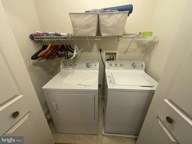 washroom featuring washing machine and dryer and laundry area