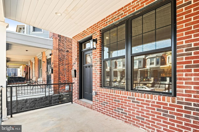 entrance to property with brick siding