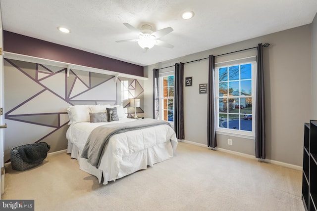 bedroom with a textured ceiling, ceiling fan, recessed lighting, baseboards, and carpet