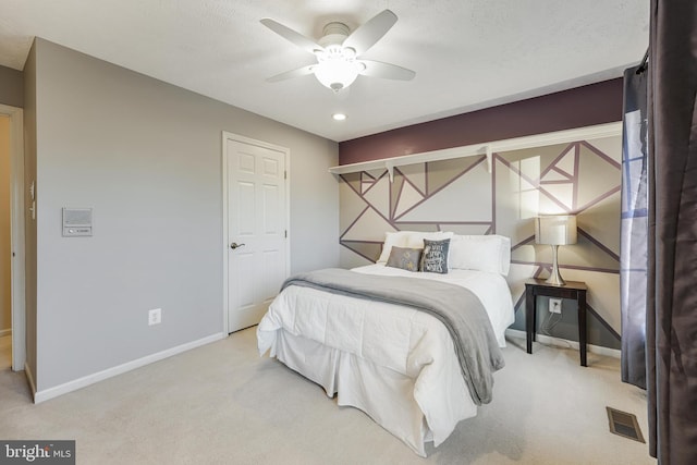 bedroom featuring a textured ceiling, carpet floors, a ceiling fan, visible vents, and baseboards