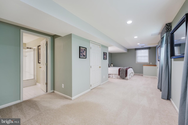 interior space with ensuite bathroom, carpet floors, recessed lighting, and baseboards