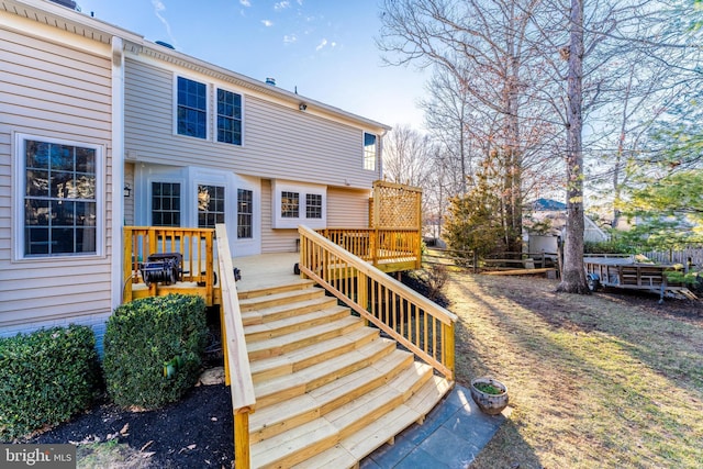 back of house featuring stairway, fence, and a wooden deck