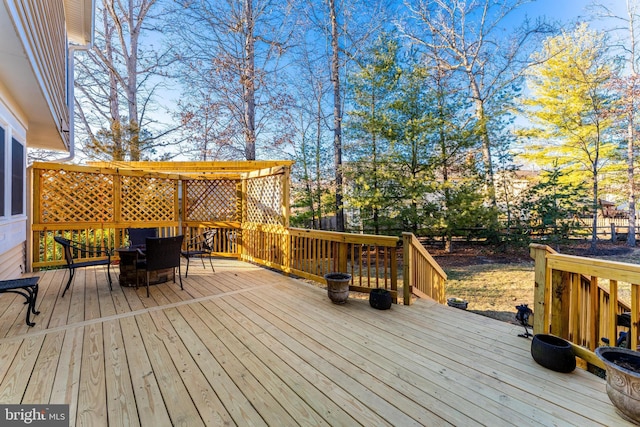 wooden deck featuring outdoor dining area