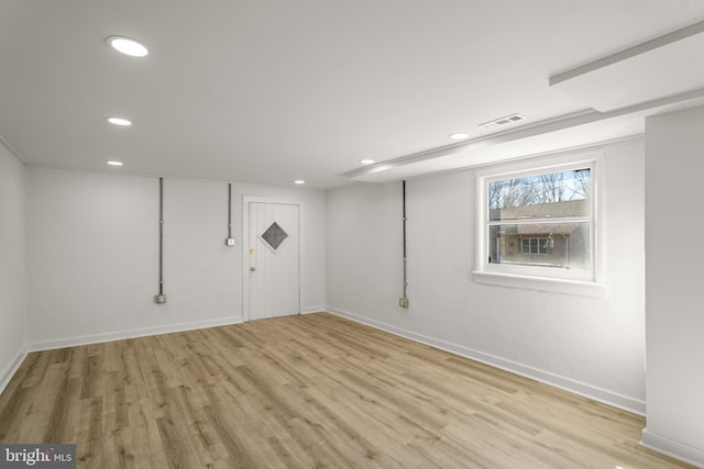 below grade area with recessed lighting, baseboards, visible vents, and light wood finished floors