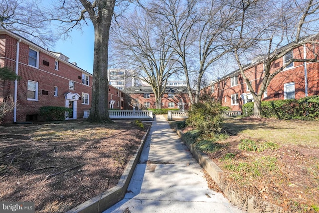 view of road with a residential view and curbs