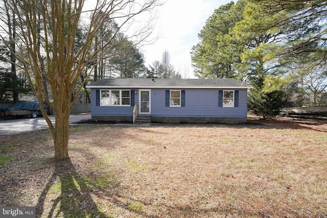 view of front of house with entry steps and fence