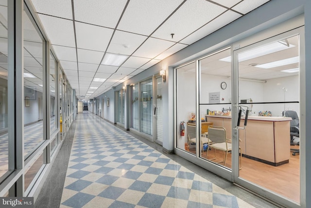 interior space featuring a drop ceiling