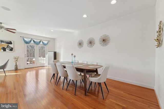 dining space featuring wood-type flooring, baseboards, a ceiling fan, and recessed lighting