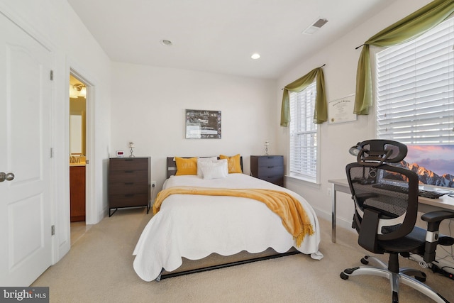 bedroom featuring light carpet, baseboards, visible vents, and recessed lighting