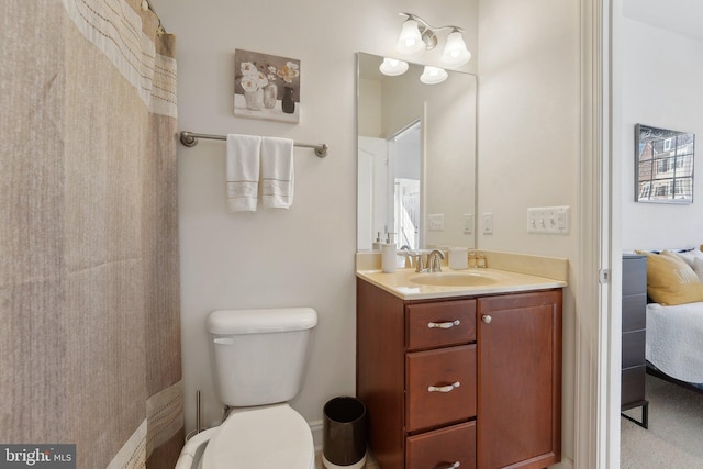 full bath featuring vanity, ensuite bath, and toilet