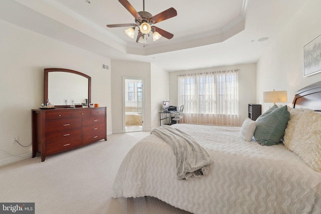 bedroom with light carpet, visible vents, ornamental molding, and a raised ceiling