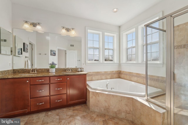 full bathroom with a sink, double vanity, a garden tub, and a shower stall