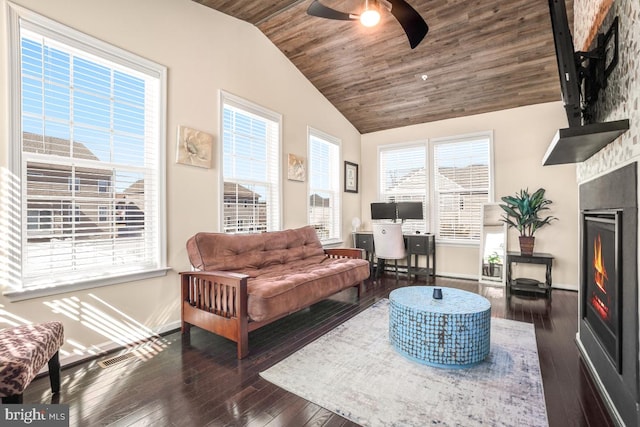 living room with lofted ceiling, a large fireplace, dark wood-style flooring, wood ceiling, and baseboards