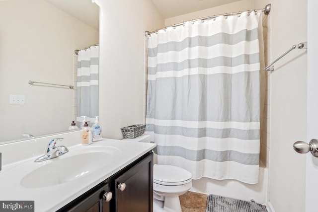 full bathroom with toilet, tile patterned flooring, and vanity