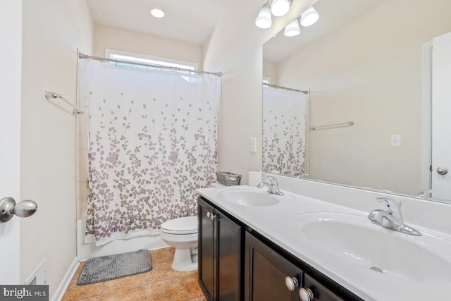 bathroom with shower / tub combo, a sink, toilet, and double vanity