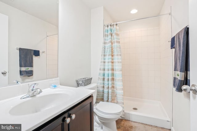 full bath with toilet, a shower stall, and vanity