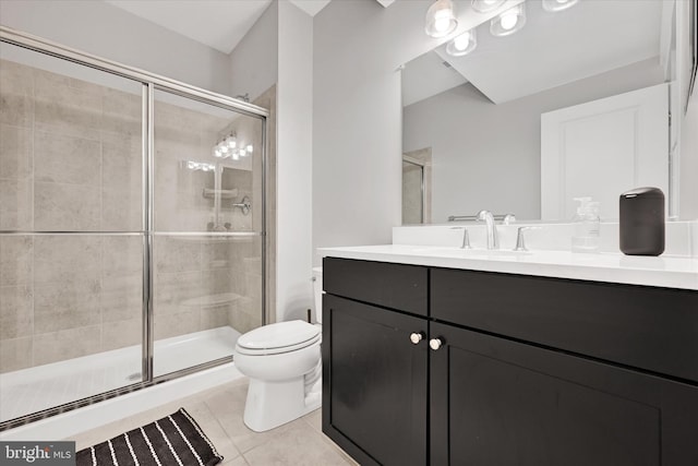 full bath with vanity, toilet, a shower stall, and tile patterned flooring