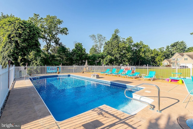 view of pool featuring fence, a fenced in pool, and a patio