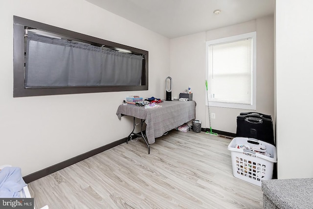 home office featuring light wood-style floors and baseboards