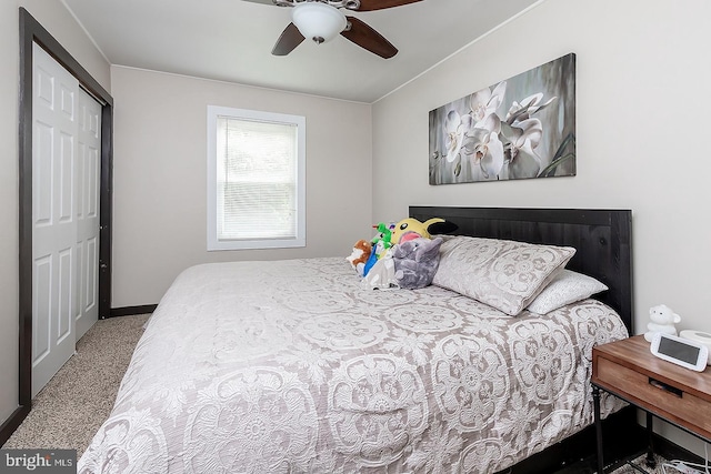 carpeted bedroom featuring a closet, a ceiling fan, and baseboards