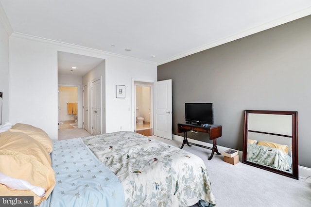 bedroom with light carpet, baseboards, ornamental molding, and connected bathroom