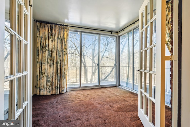 unfurnished sunroom featuring french doors