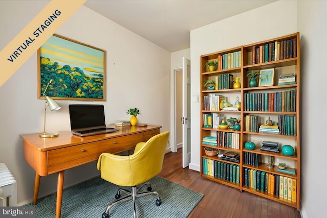 office area with wood-type flooring and baseboards