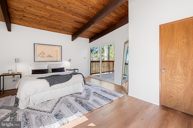 bedroom with access to exterior, baseboards, lofted ceiling with beams, wooden ceiling, and wood finished floors