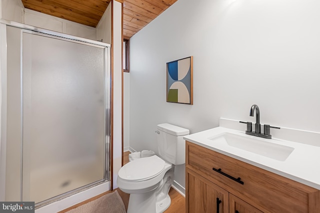 full bathroom with toilet, wood ceiling, a stall shower, and vanity