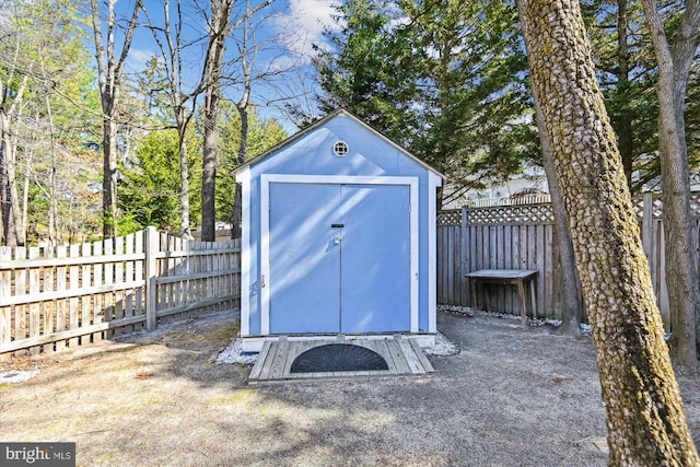 view of shed with a fenced backyard