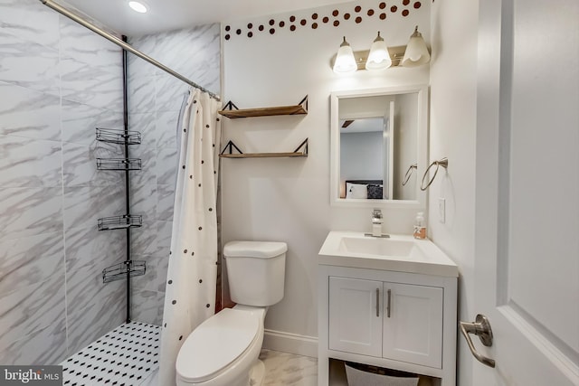 bathroom featuring marble finish floor, tiled shower, vanity, and toilet