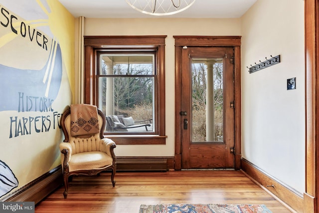 interior space featuring wood finished floors and baseboards