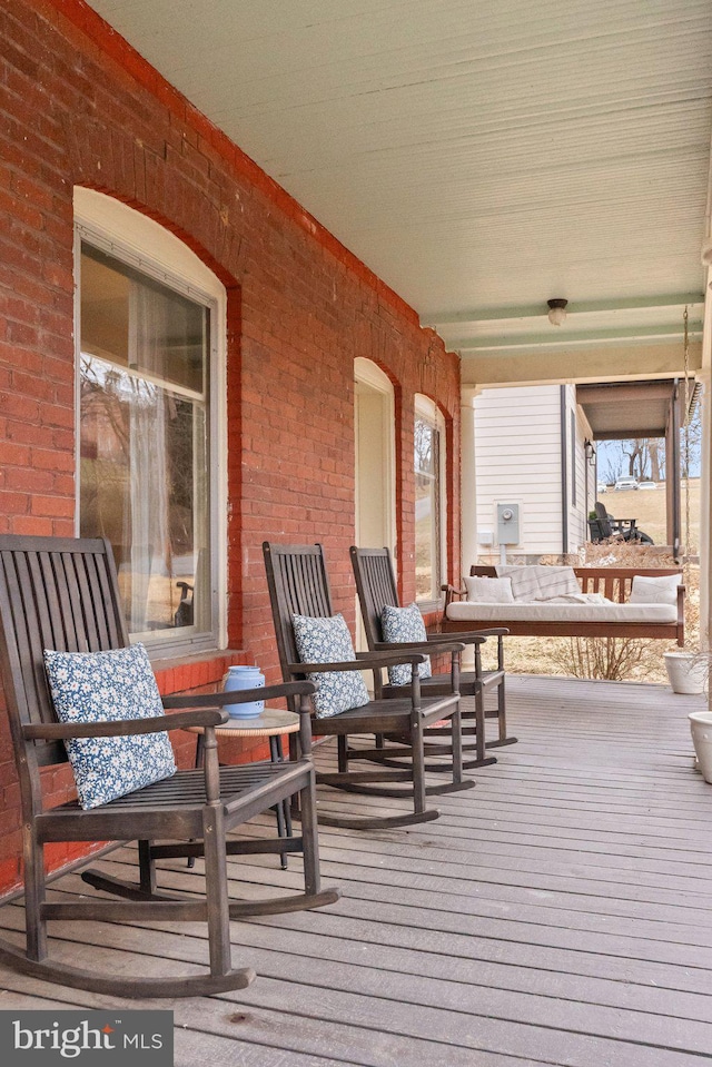 wooden deck featuring a porch