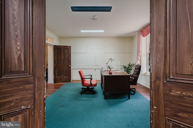 home office with wood finished floors