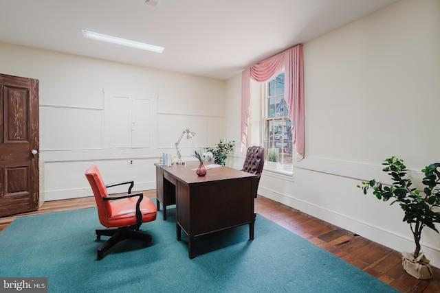 home office with wood finished floors