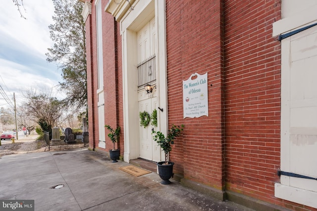 entrance to property with brick siding