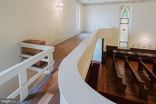 interior space with wainscoting and hardwood / wood-style floors