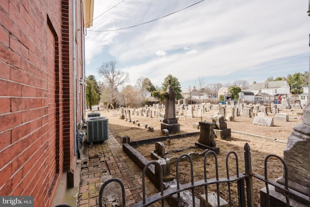 view of patio with fence and central air condition unit