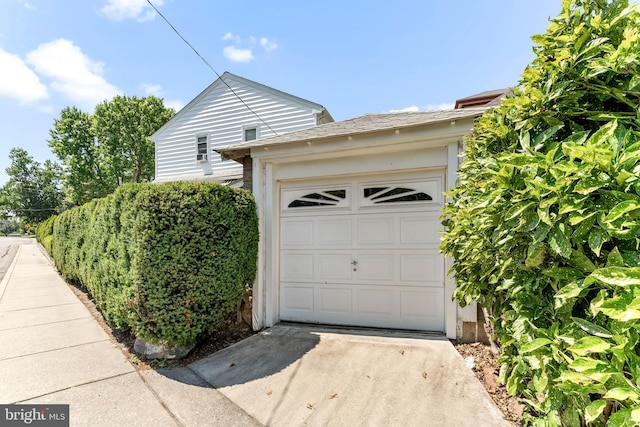 garage featuring driveway