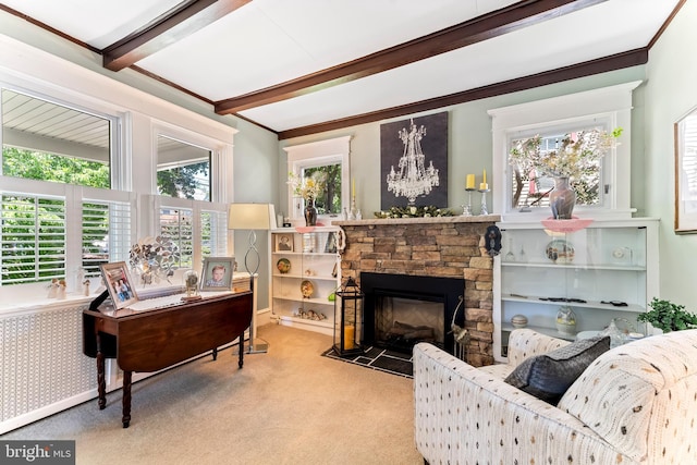 sitting room with light carpet, a stone fireplace, beamed ceiling, and ornamental molding