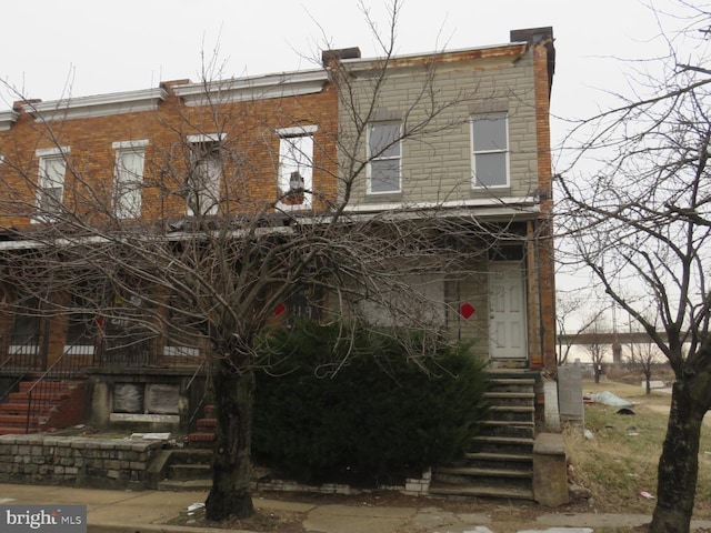 townhome / multi-family property featuring brick siding