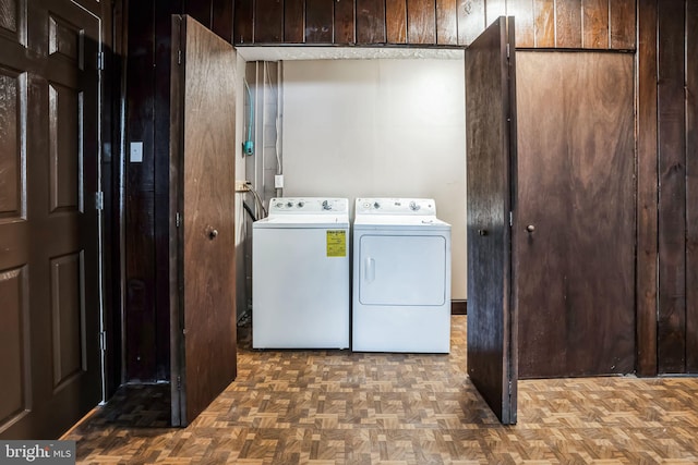 washroom featuring laundry area and separate washer and dryer