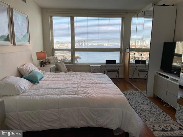 bedroom with wood finished floors