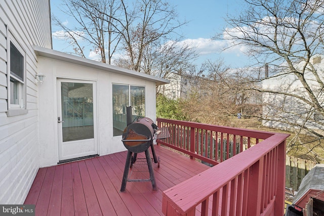 wooden deck featuring grilling area