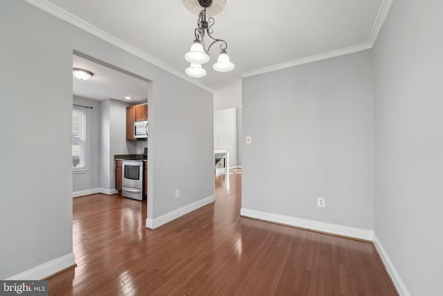 unfurnished dining area featuring a notable chandelier, crown molding, baseboards, and dark wood-type flooring