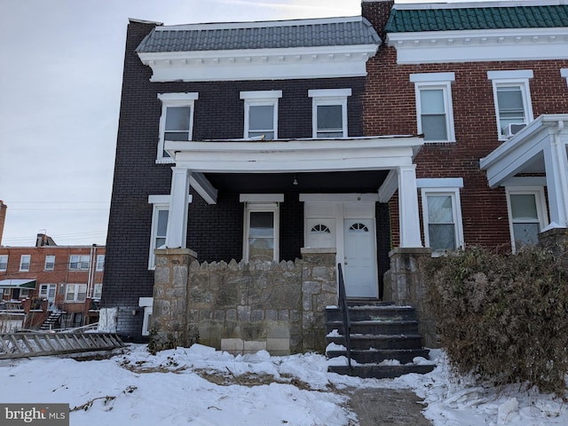 view of property with brick siding