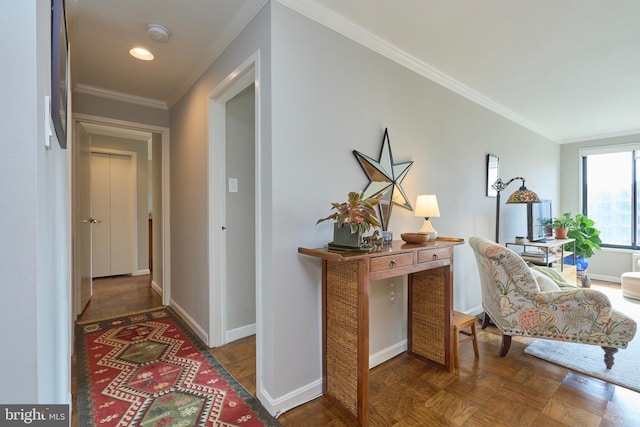 hallway featuring baseboards and crown molding