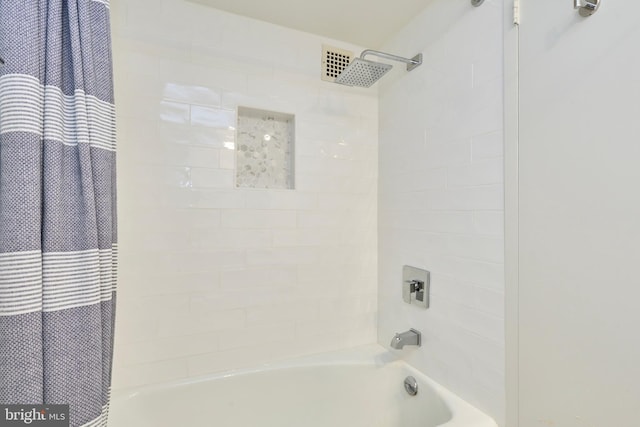 bathroom with shower / bathtub combination with curtain