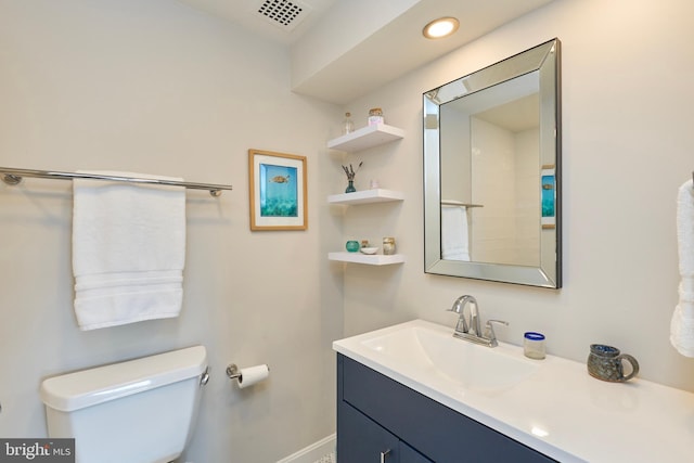 bathroom with visible vents, baseboards, toilet, vanity, and recessed lighting