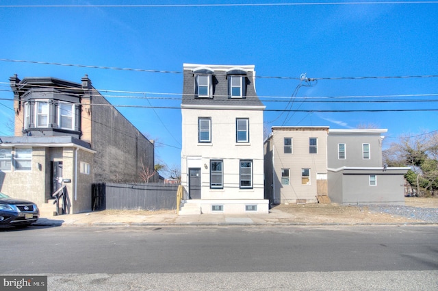 view of front of house with fence